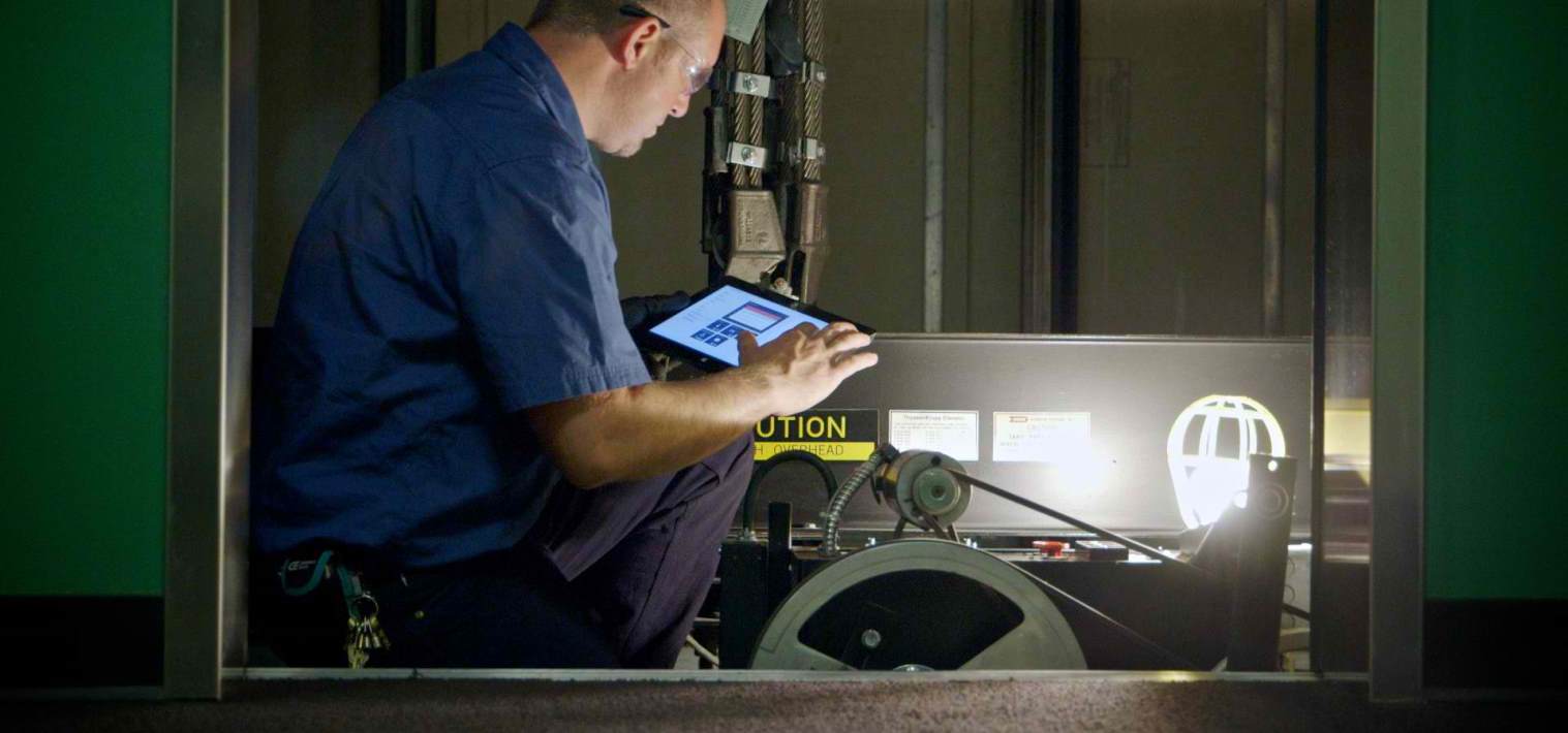 AVS commercial elevator inspections, technician inspecting elevator